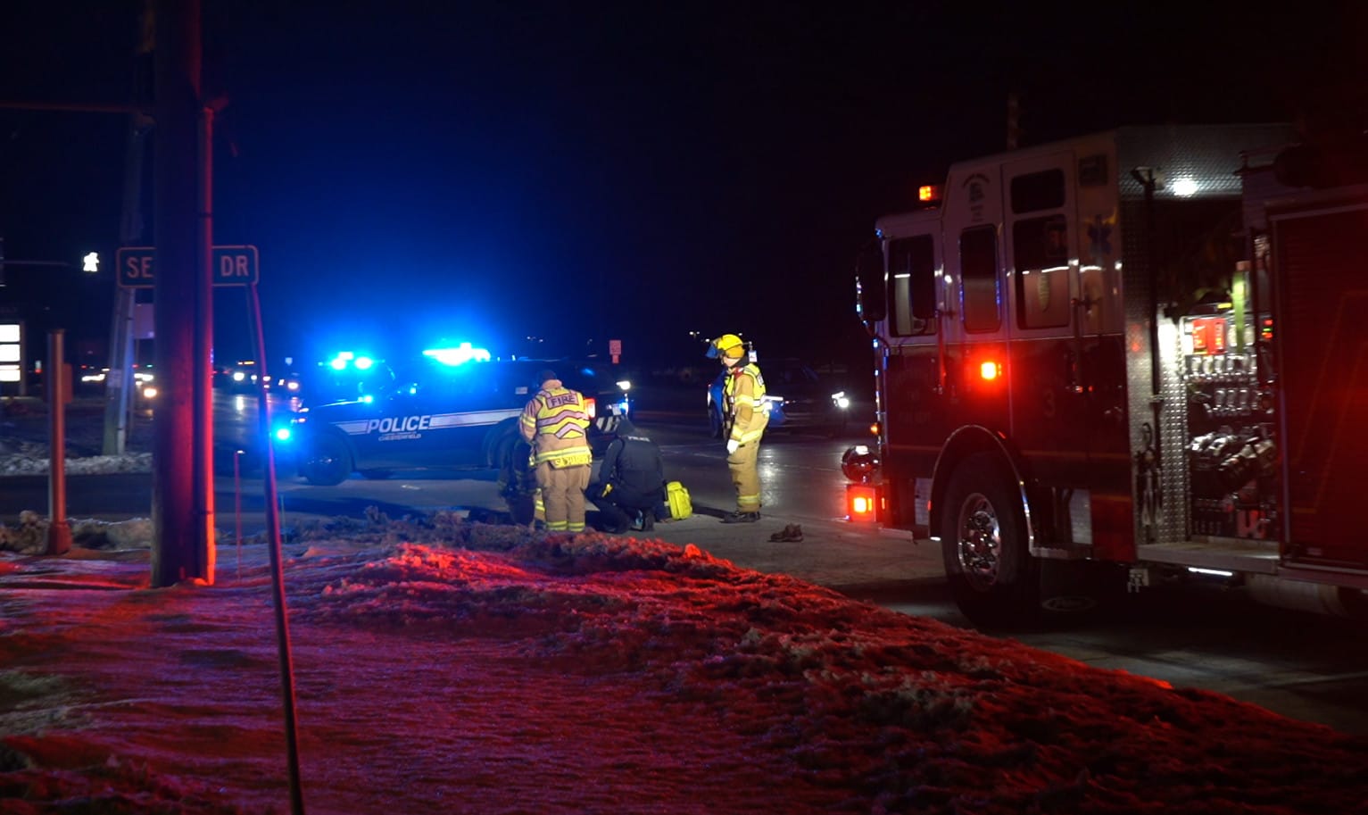 Chesterfield Township police and fire units with emergency lights at a nighttime roadway scene