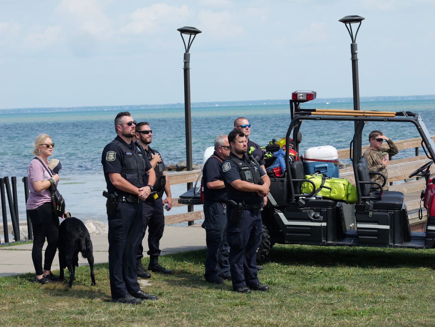 Chesterfield Township officers and a K-9 at a waterfront community event