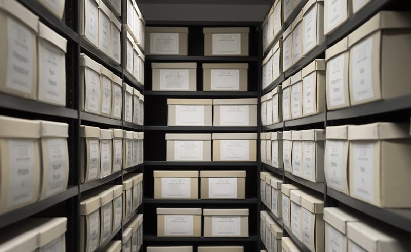 Sealed evidence boxes on shelves in the Chesterfield Township police property room