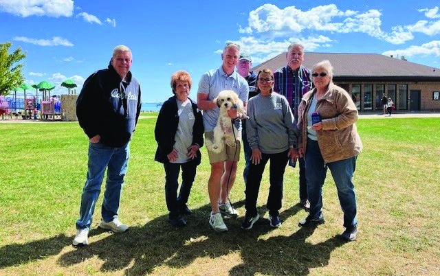 Director Brian Bassett holding Chester with the Friends of Chesterfield Police at the officer family picnic, September 2025