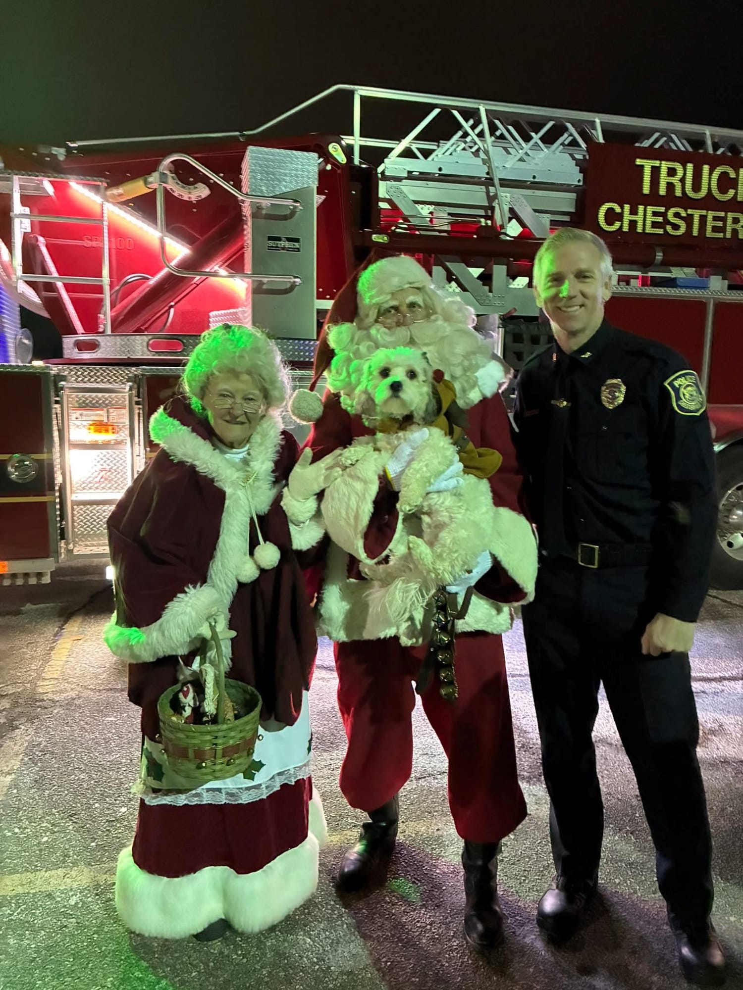 Chester with Santa at a holiday event