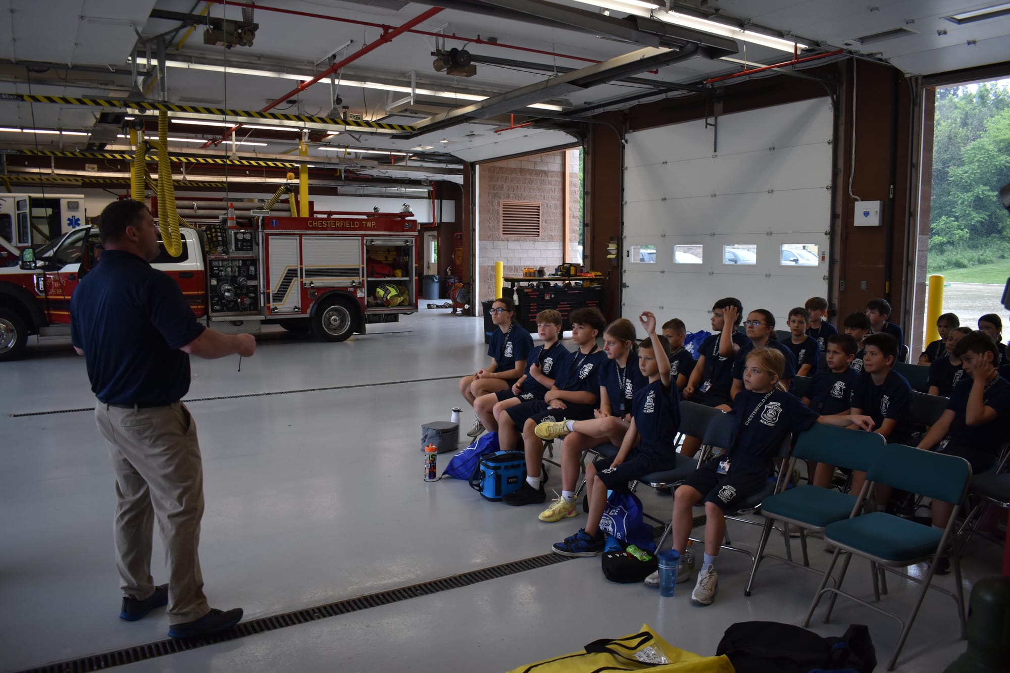 Academy students learning at a Chesterfield Township fire station