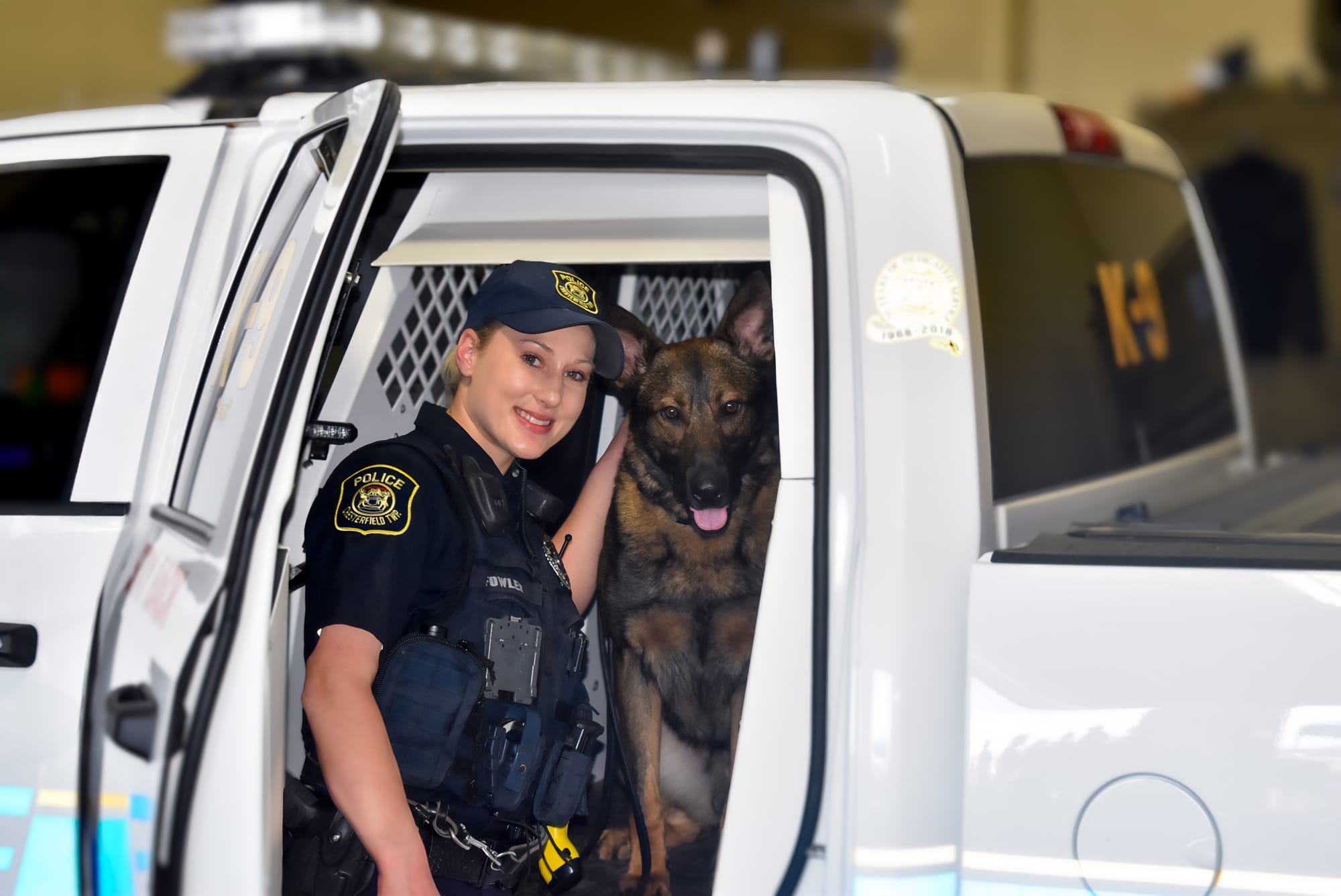 Officer Hallie Fowler and K-9 Hemi in the K-9 unit truck