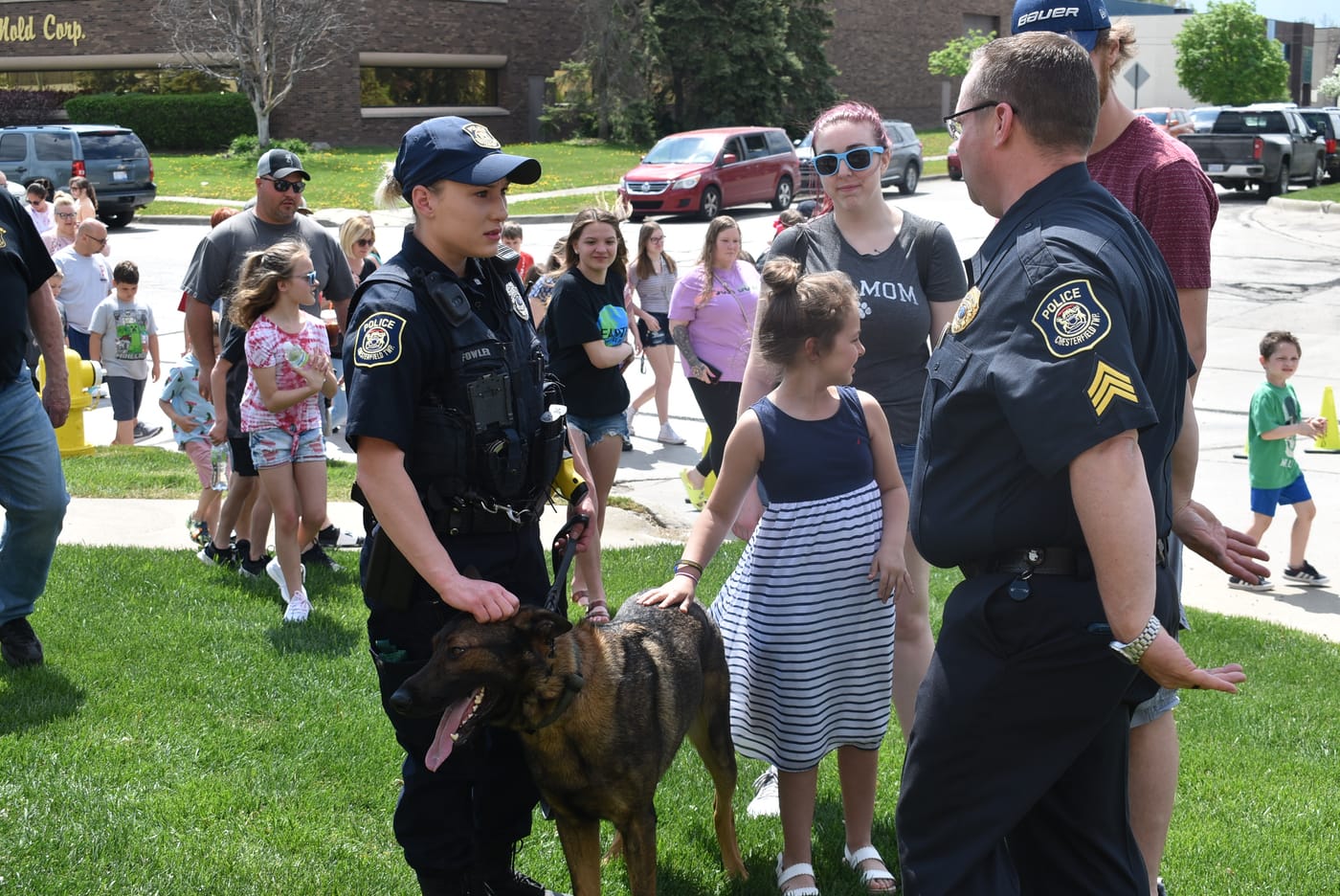 K-9 team meeting children at a community event