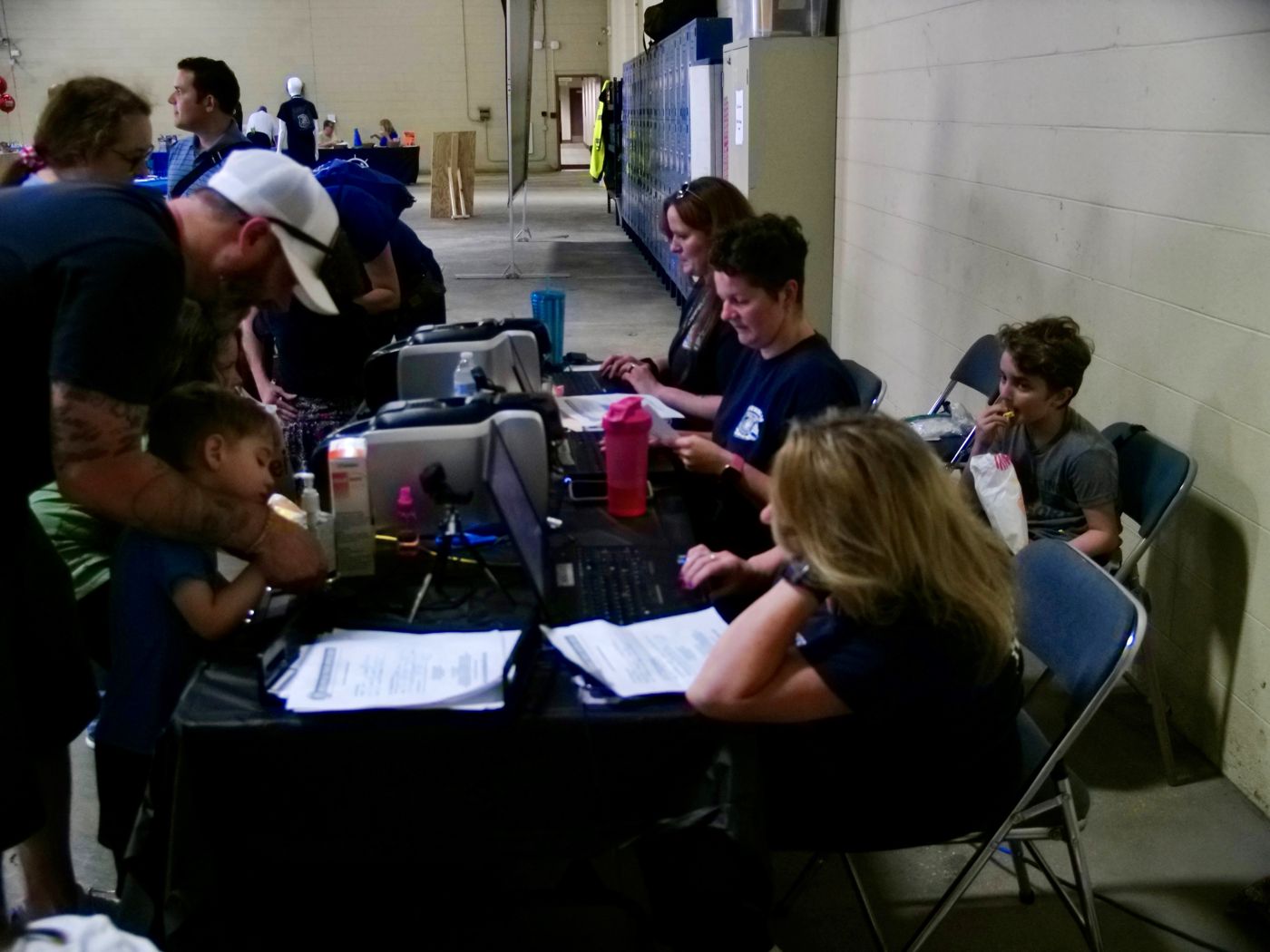 Families at the kID Print tables at the 2024 open house