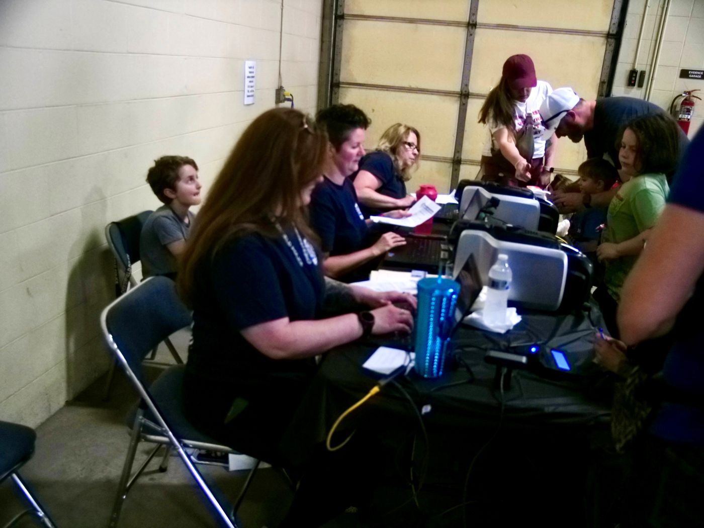 Volunteers recording a child's kID Print details