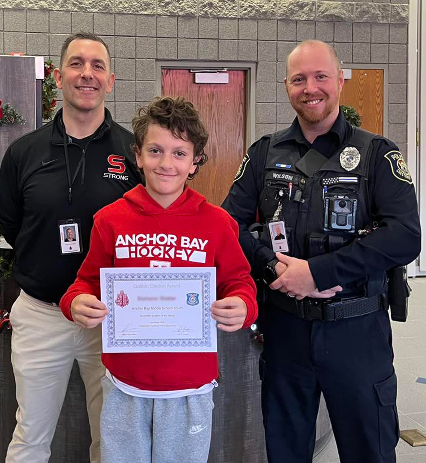Officer Ryan Wilson with a student on School Resource Officer appreciation day
